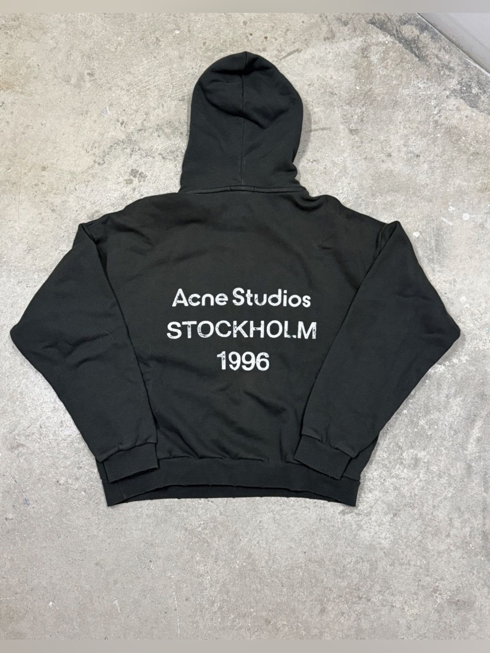 Acne Studios black hoodie with white Stockholm 1996 print